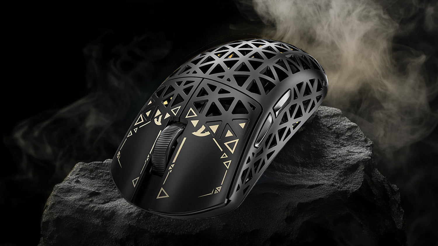 A black gaming mouse with a honeycomb design and gold accents, resting on a rock-like surface with smoke in the background. The mouse features geometric patterns and a visible scroll wheel