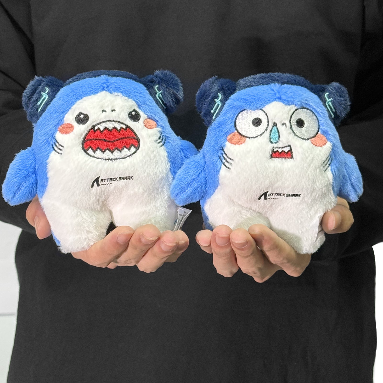 Attack Shark mascot plush toy held in hands