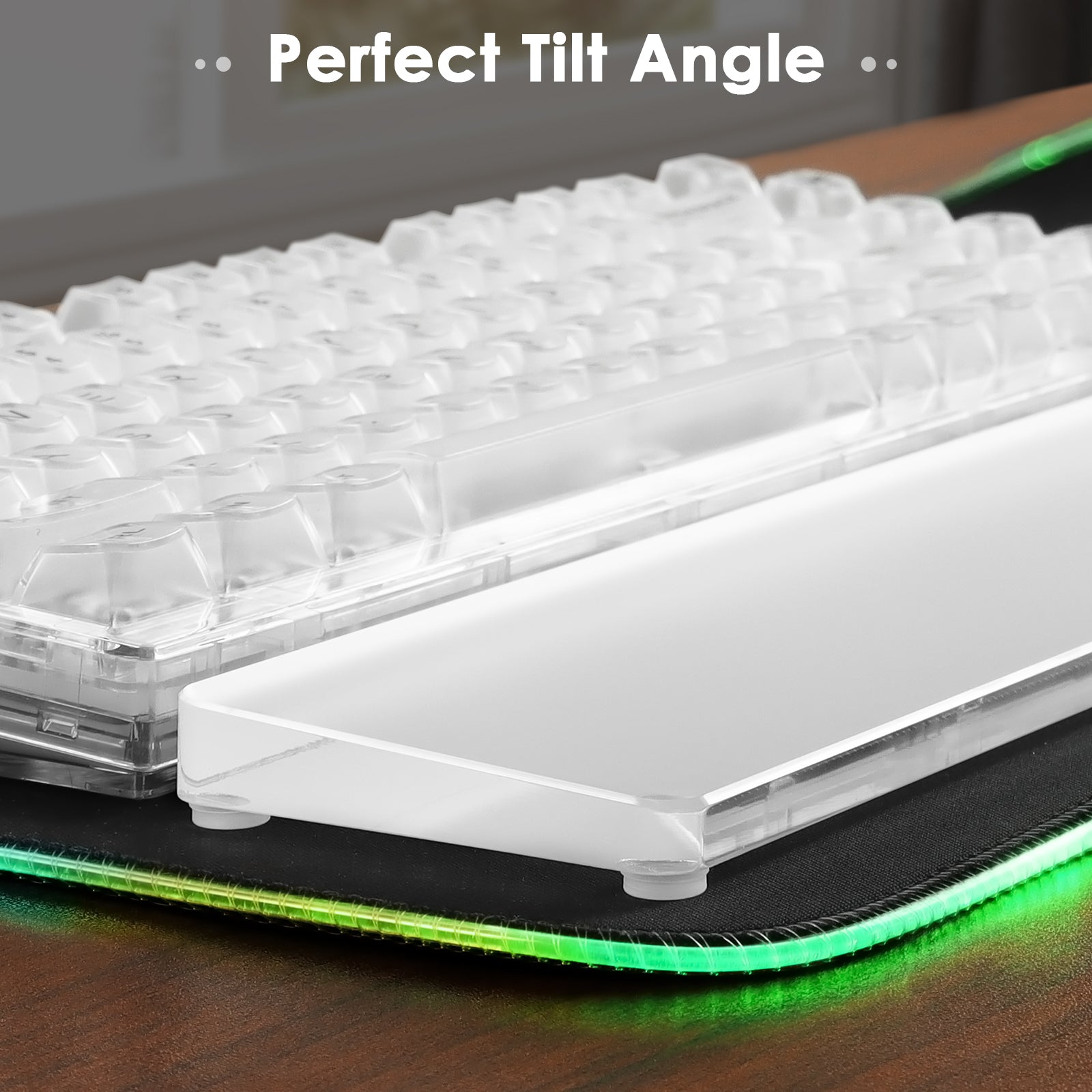 Acrylic wrist rest positioned for optimal tilt beside a mechanical keyboard.