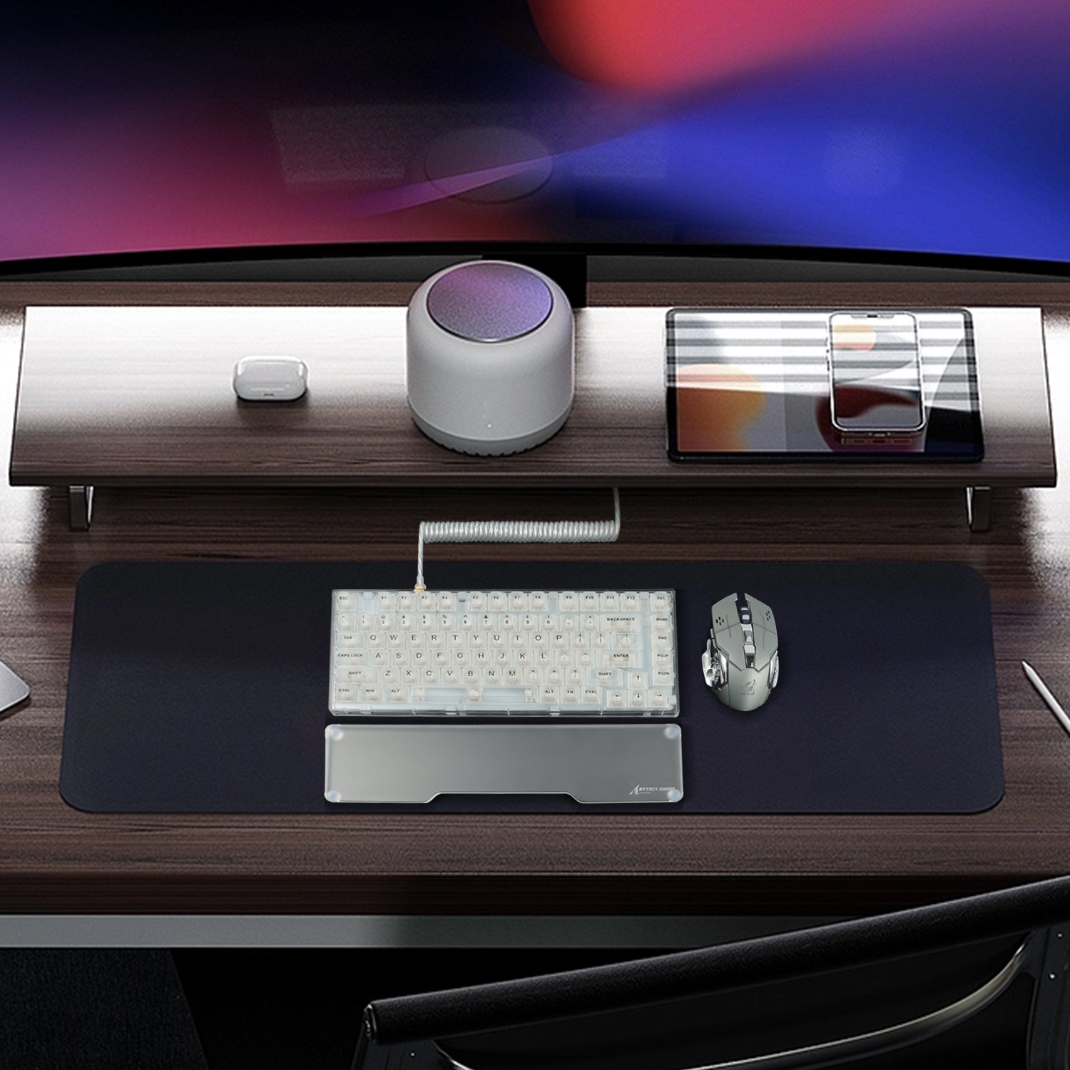 Modern desk setup with red and white mechanical keyboard, clear acrylic wrist rest, and mouse.