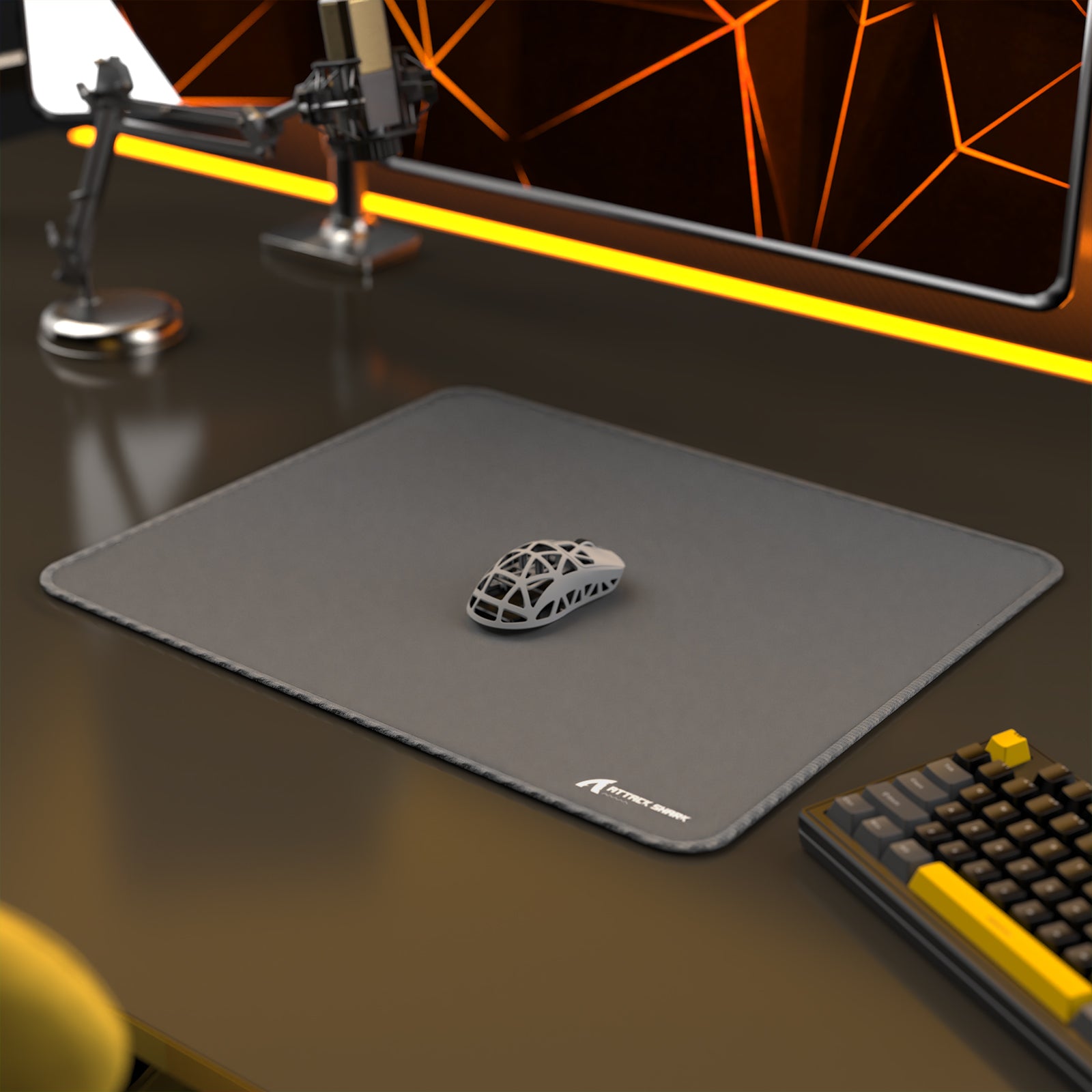 ATTACK SHARK CM02 esports mousepad, dark gray with a gaming mouse, keyboard, and esports setup.