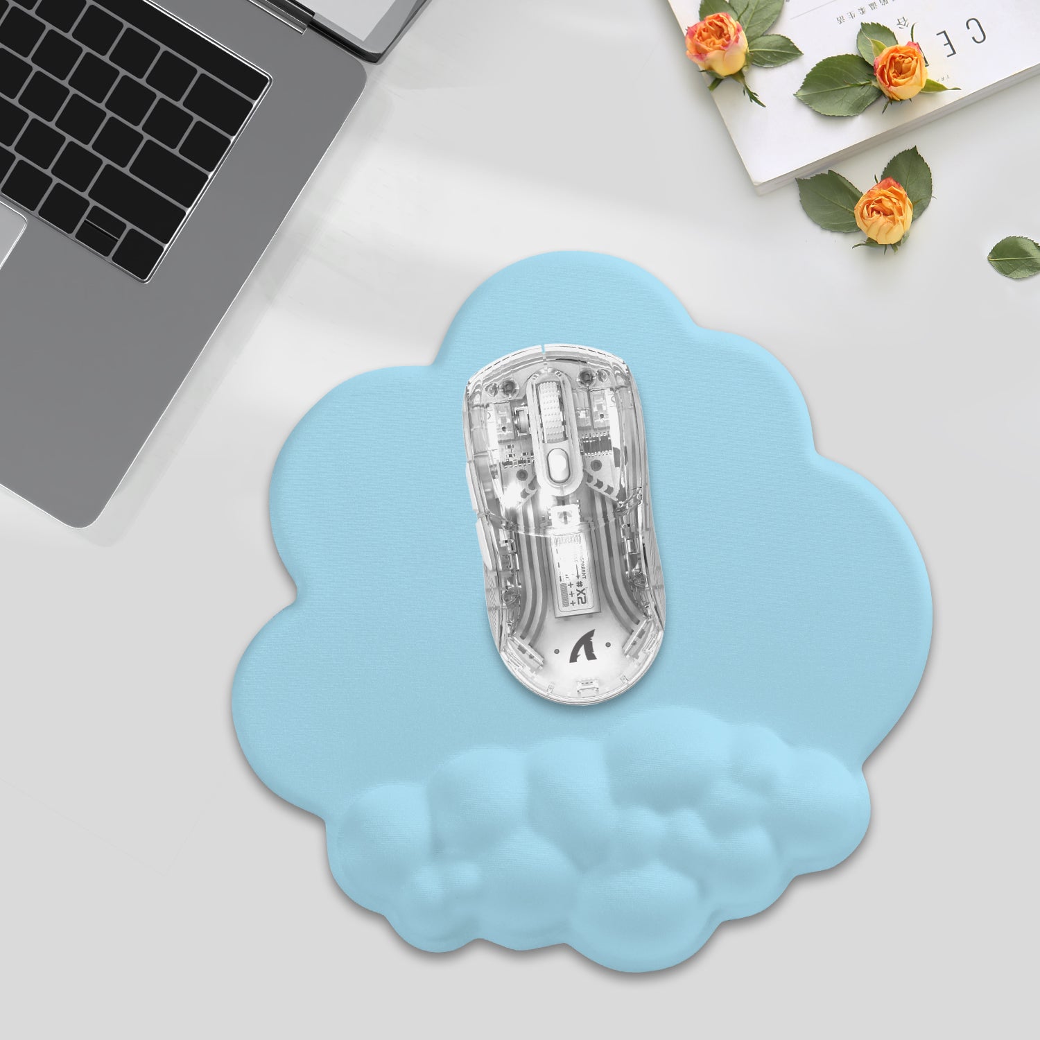 Light blue cloud mouse pad with ergonomic support and transparent gaming mouse for smooth tracking.