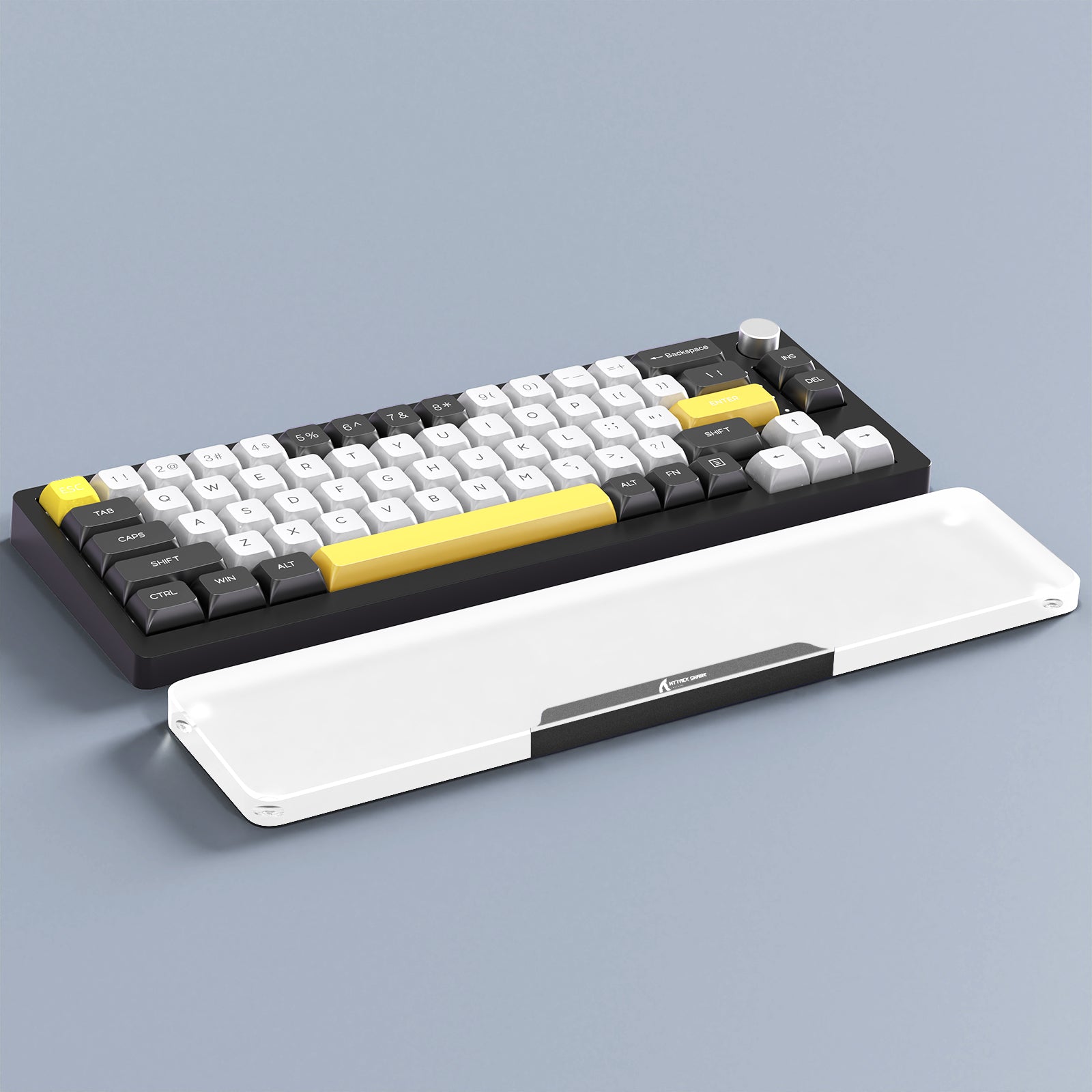 Mechanical keyboard with yellow accents and white acrylic wrist rest